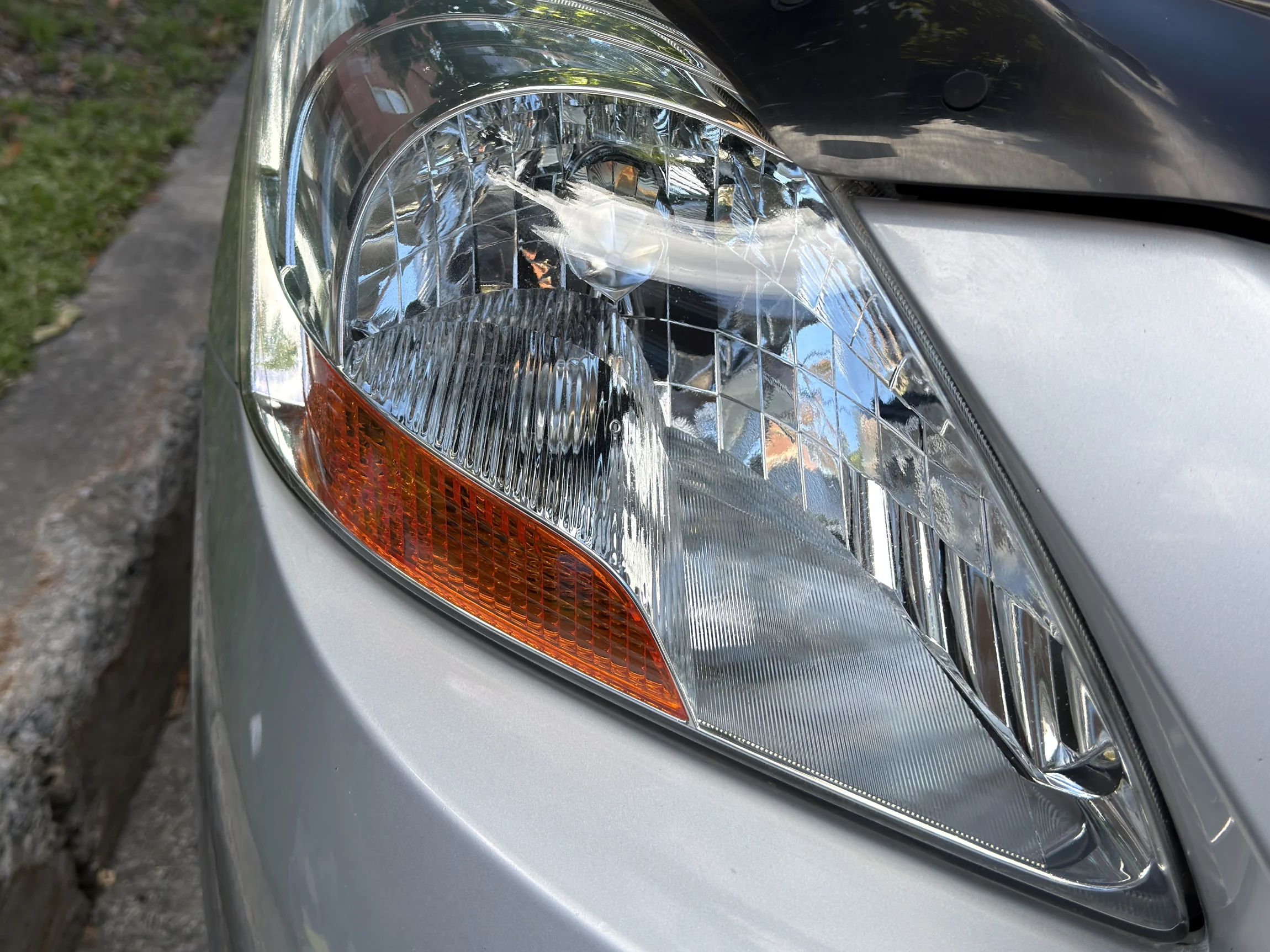 Toyota Yaris headlight after restoration — clear and bright