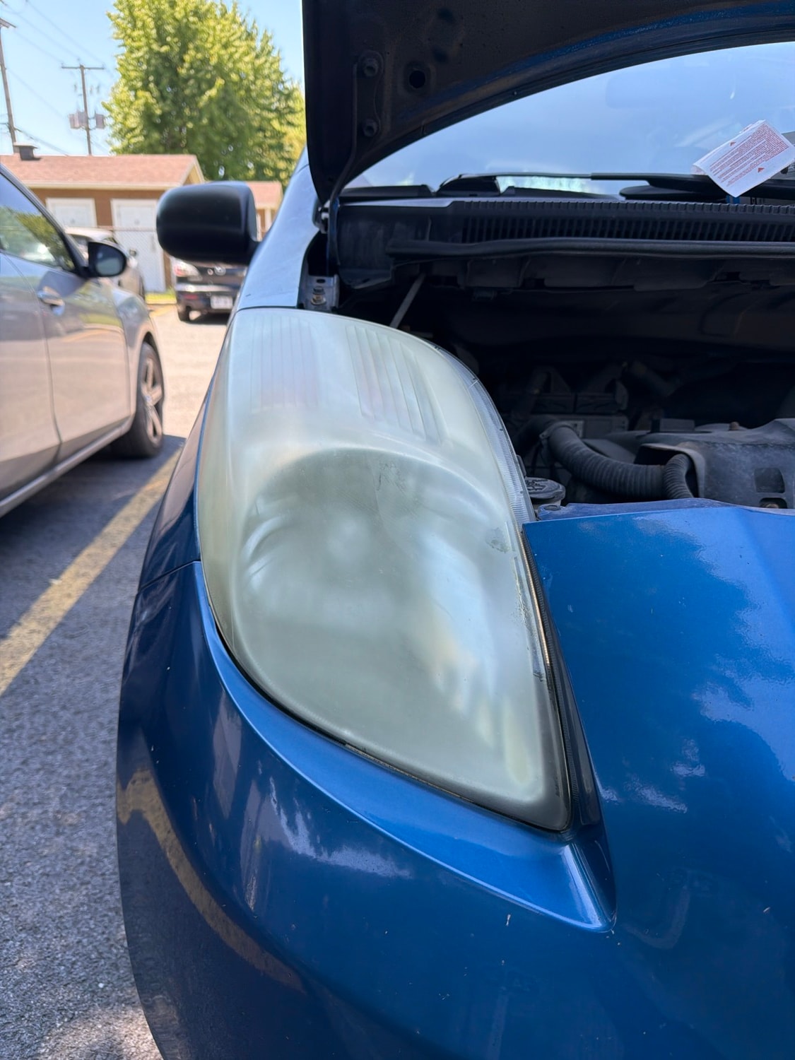 Yellowed Toyota Yaris headlights before restoration